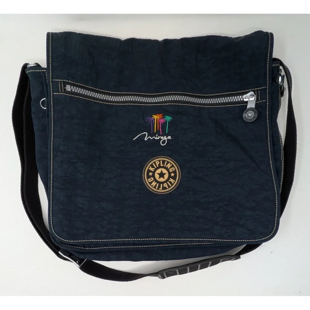 Kipling Madhouse Postman Bag Mirage Las Vegas Logo Expandable Messenger Bag Blue